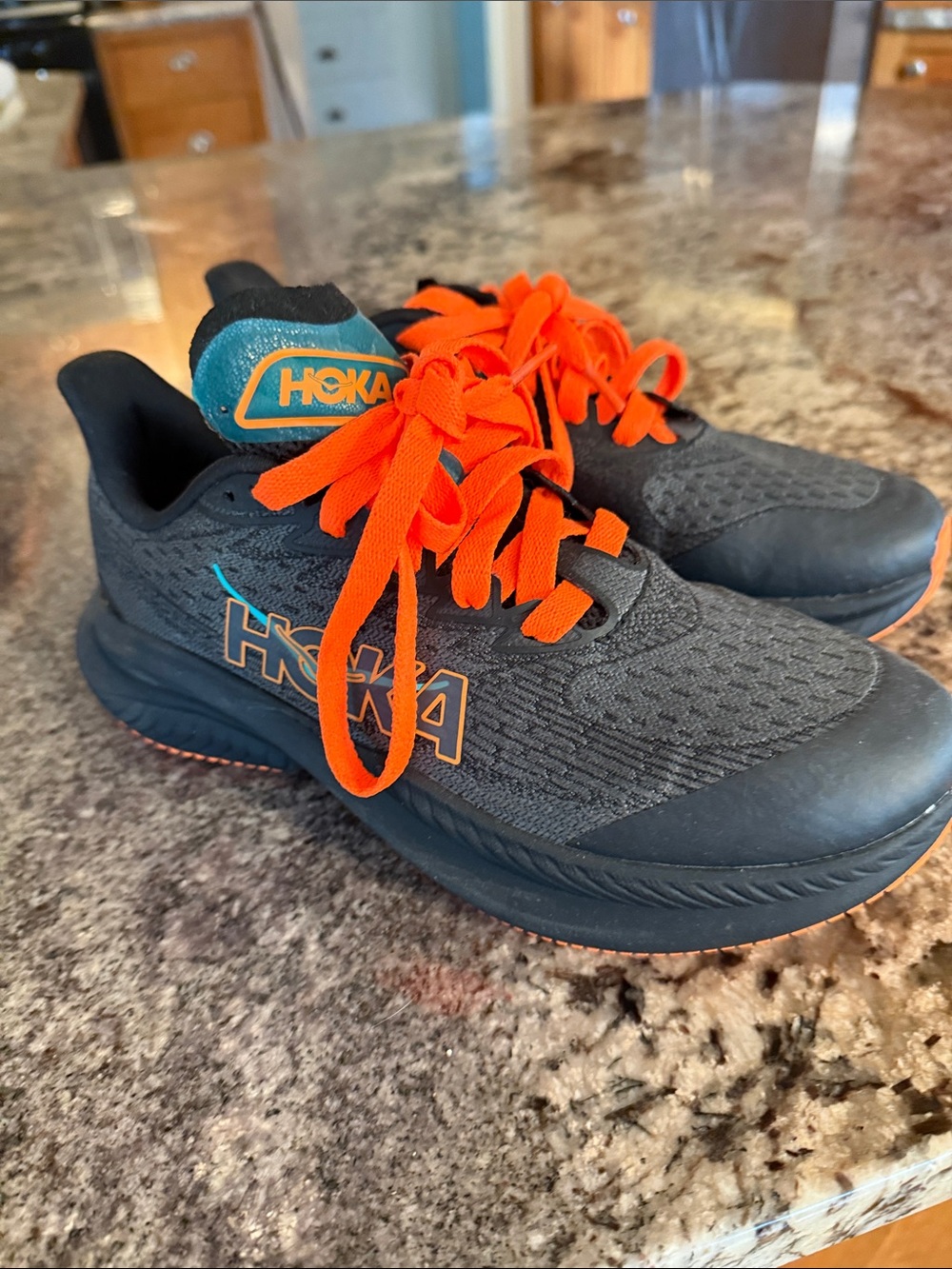 Hoka Kids Black Sneakers with Bright Orange Laces- brand new. Never worn